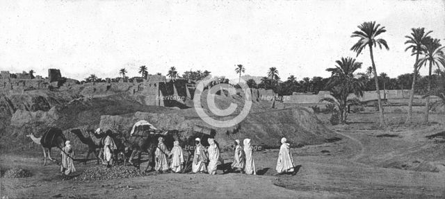''A Caravan approaching an old Fort in Biskra', 1890. Creator: Unknown.