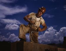 A carpenter at the TVA's new Douglas dam on the French Broad River, Tenn., 1942. Creator: Alfred T Palmer