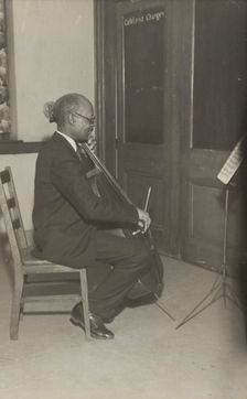 A cello student of the Adult Education Classes under the Federal Music Project at Carlton YMCA, 1936 Creator: Unknown