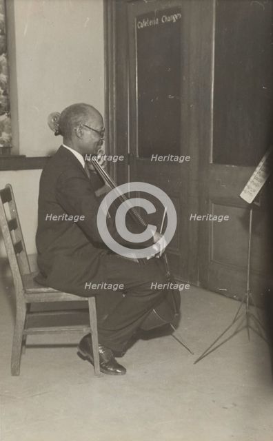 A cello student of the Adult Education Classes under the Federal Music Project at Carlton YMCA, 1936 Creator: Unknown.