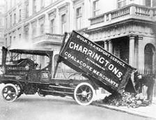A Charrirngtons lorry unloading coal. Creator: Unknown