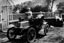 A child at the wheel of a De Dion Bouton car, 1903