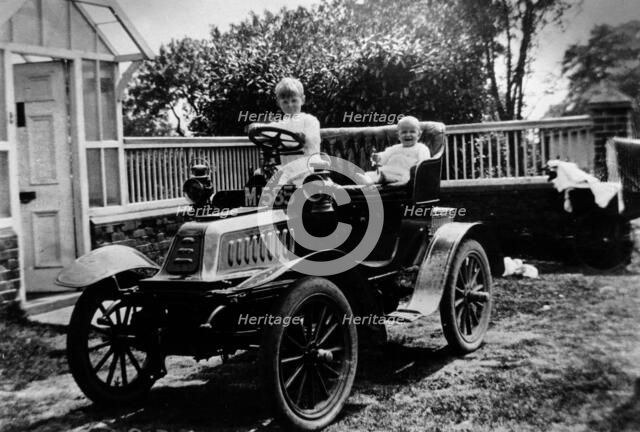 A child at the wheel of a De Dion Bouton car, 1903. Artist: Unknown