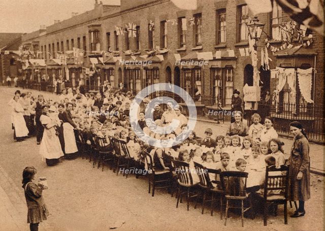 ' A children's tea party in an East End Street in London, to celebrate the Treaty of Versailles at t Artist: Unknown.