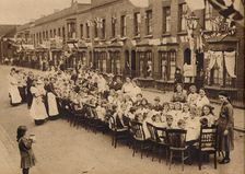 A children's tea party in an East End Street in London, to celebrate the Treaty of Versailles at t