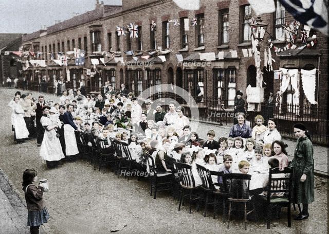 ' A children's tea party in an East End Street in London, to celebrate the Treaty of Versailles at t Artist: Unknown.