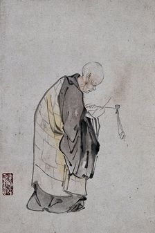 A Chinese man lighting a pipe, (between 1800 and 1899?). Creator: Unknown