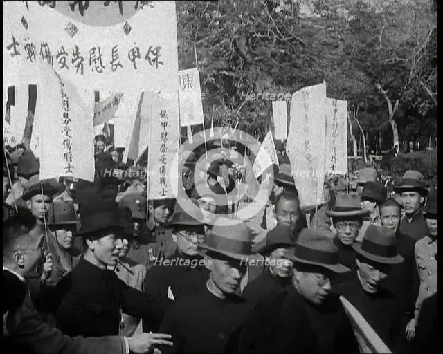 A Chinese Anti-War Protest With Male Attendees Both Military and Civilian Present Some..., 1938. Creator: British Pathe Ltd.