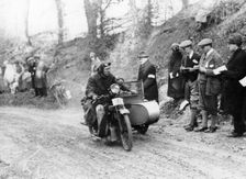 A competitor riding a Norton, competing in the Colmore Cup Trial, 1921