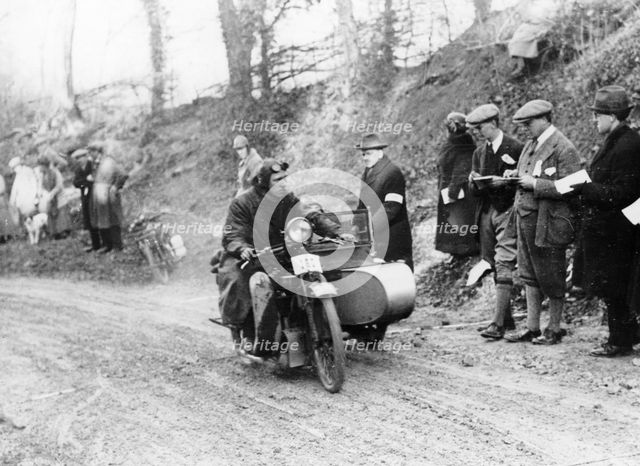 A competitor riding a Norton, competing in the Colmore Cup Trial, 1921. Artist: Unknown