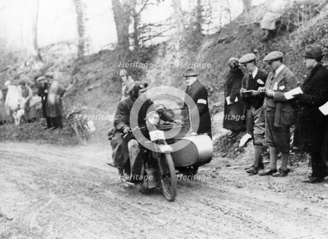 A competitor riding a Norton, competing in the Colmore Cup Trial, 1921. Artist: Unknown