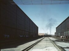 A completely overhauled engine on the transfer table at the Atchison, Topeka..., New Mexico., 1943. Creator: Jack Delano