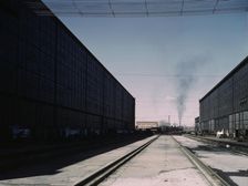 A completely overhauled engine on the transfer table at the Atchison, Topeka..., New Mexico., 1943. Creator: Jack Delano