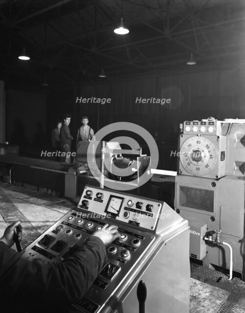A continuous forge in operation at the Edgar Allen Steel Founders, Meadowhall, Sheffield, 1962.  Artist: Michael Walters