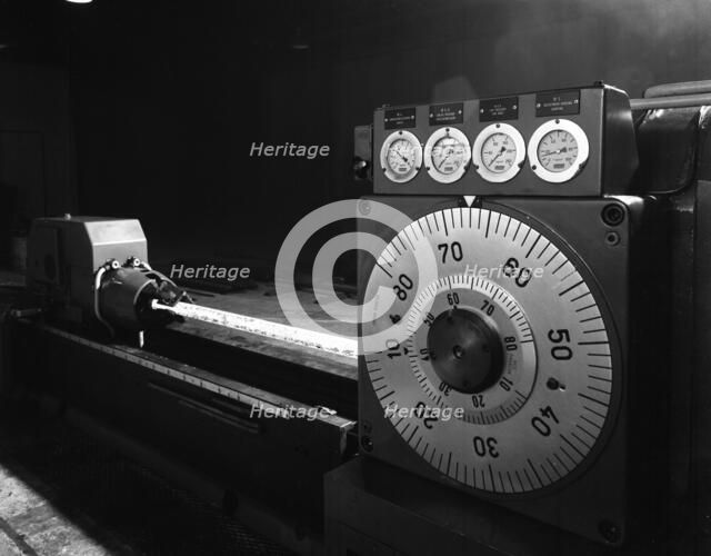 A continuous forge in operation at the Edgar Allen Steel Founders, Meadowhall, Sheffield, 1962.  Artist: Michael Walters