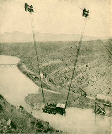 A Contractor's Engine Being Swung Across A Canyon, Rio Grande River, New Mexico 1930. Creator: Unknown