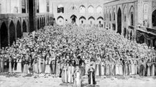 A congregation faces the holy Kaaba in Mecca's mosque, Saudi Arabia, 1922