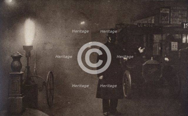 A constable directing traffic in the fog, London, c1910s-c1920s(?). Creator: Unknown.