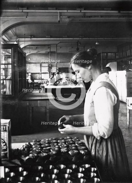A cook makes pastry in the factory kitchens, Rowntree’s factory, York, Yorkshire, 1913. Artist: Unknown