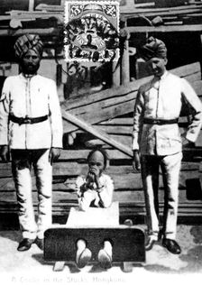 A coolie in the stocks, Hong Kong, 1908