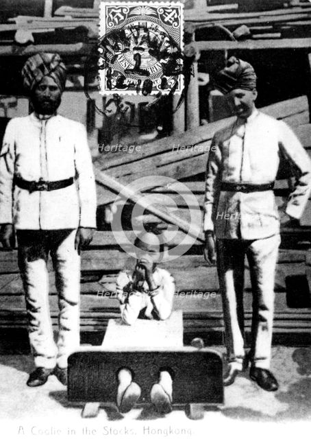 A coolie in the stocks, Hong Kong, 1908. Artist: Unknown