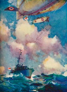 A coast patrol airship sending a despatch by motor launch c1919 (1919).. Artist: Frank Henry Mason