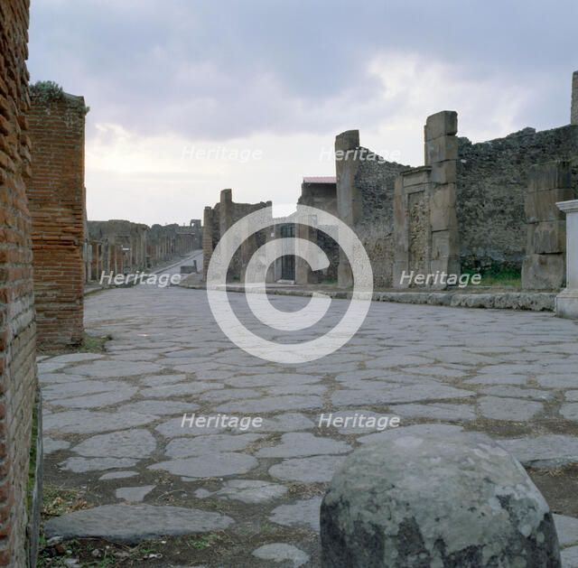 A cobblestone Roman road in Pompeii, Italy. Creator: Unknown.