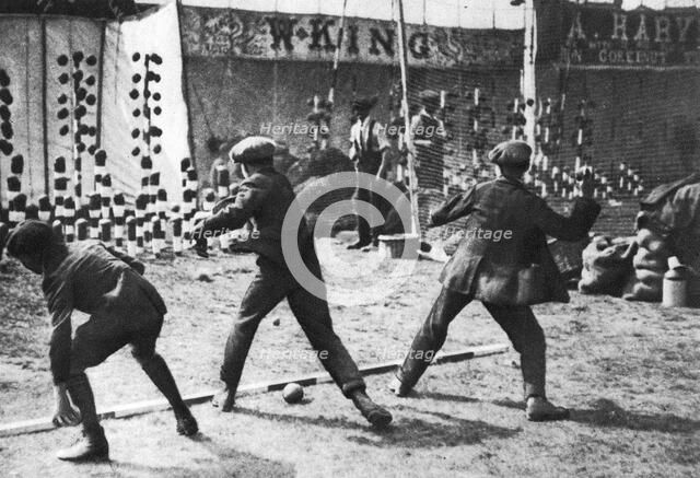 A coconut shy during a bank holiday on Blackheath Common, London, 1926-1927.Artist: Hall