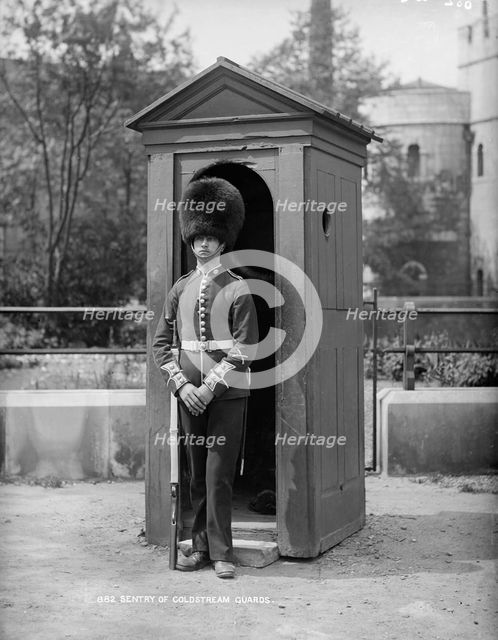 A Coldstream Guard at his sentry box, c1870-c1900. Artist: York & Son