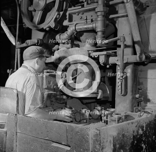 A core blowing machine, New Britain, Connecticut, 1943. Creator: Gordon Parks.