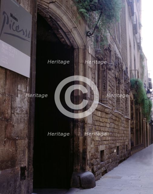 A corner of Montcada street in Barcelona with the Picasso Museum entry.