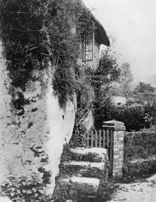 A cottage with an ancient upping stock Cockington, Devon, 1924-1926.Artist: HJ Smith