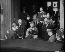 A Close up of Adolf Hitler, the German Leader, on the Front Steps of a Building Leaning..., 1938. Creator: British Pathe Ltd