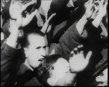 A Close up of Austrian Civilians Performing the German Nazi Salute, 1938. Creator: British Pathe Ltd