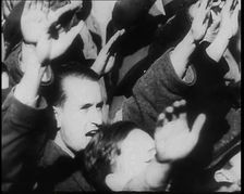 A Close up of Austrian Civilians Performing the German Nazi Salute, 1938. Creator: British Pathe Ltd