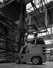 A Clark forklift truck, Spillers Animal Foods, Gainsborough, Lincolnshire, 1962. Creator: Michael Walters