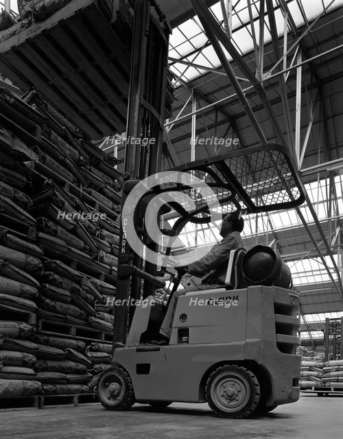 A Clark forklift truck, Spillers Animal Foods, Gainsborough, Lincolnshire, 1962. Creator: Michael Walters.