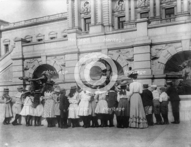 A class of the 2nd Division at the fountain in front of the Library of Congress, (1899?). Creator: Frances Benjamin Johnston.