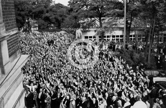 A crowd gathered beneath Adolf Hitler's window, Bayreuth, Germany, 1936. Artist: Unknown