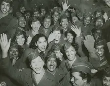 A crowd of African American Women's Army Corps members waving at the camera..., 1946. Creator: Unknown