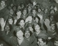A crowd of African American Women's Army Corps members waving at the camera..., 1946. Creator: Unknown