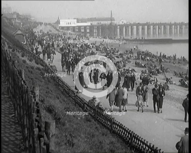 A Crowd of Civilians Sitting on Deckchairs at the Beach, 1926. Creator: British Pathe Ltd.