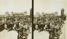 A crowd of Japanese soldiers; Chinese coolies in right foreground, Manchuria, c1905. Creator: Underwood & Underwood