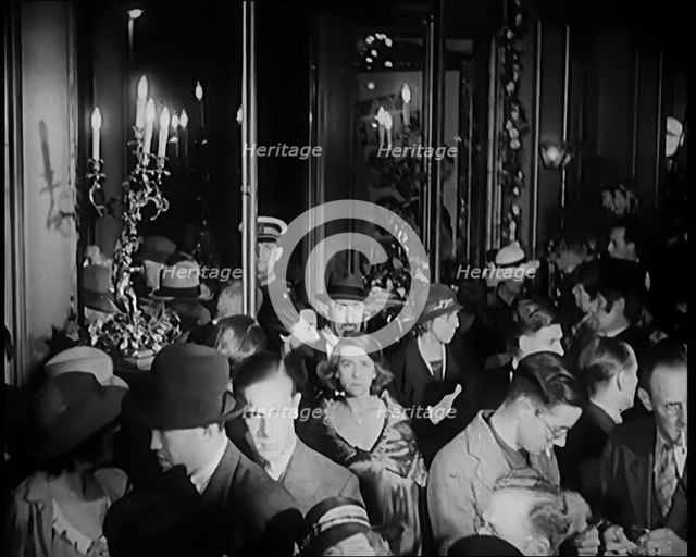A Crowd of People Filing Into the Foyer of a Theatre, 1931. Creator: British Pathe Ltd.