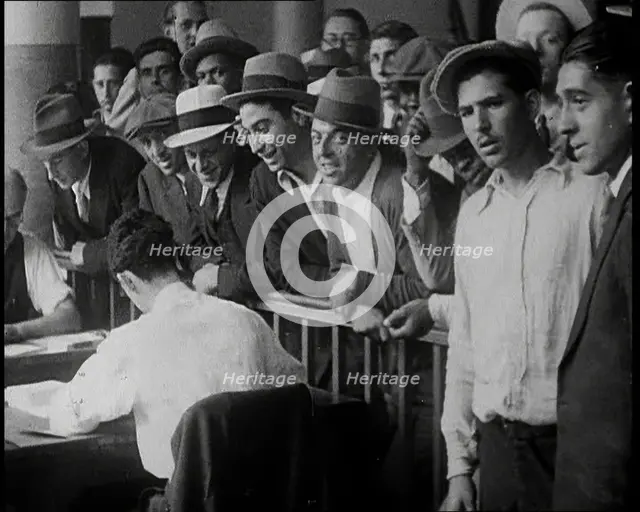 A Crowd of People Inside an Employment Agency Asking For Work, 1932. Creator: British Pathe Ltd.
