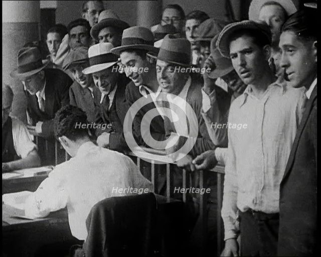 A Crowd of People Inside an Employment Agency Asking For Work, 1932. Creator: British Pathe Ltd.
