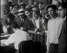 A Crowd of People Inside an Employment Agency Asking For Work, 1932. Creator: British Pathe Ltd