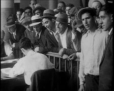 A Crowd of People Inside an Employment Agency Asking For Work, 1932. Creator: British Pathe Ltd