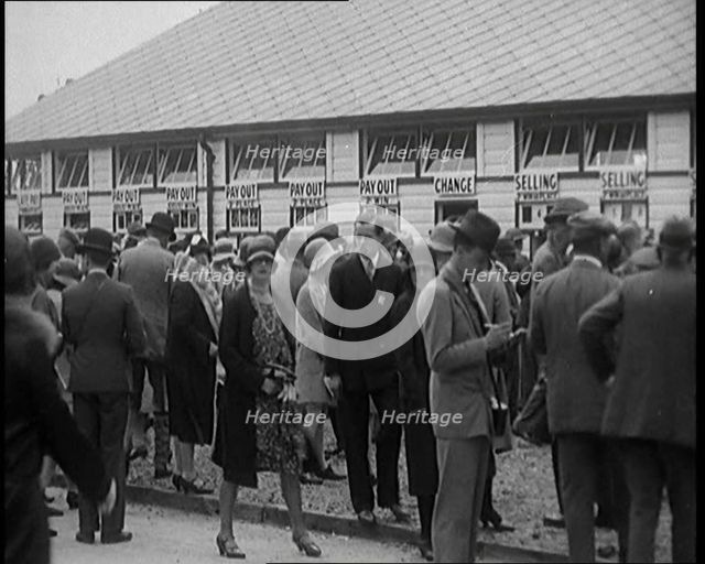 A Crowd of People Standing Outside a Totaliser/Tote Office at a Horse Race Course..., 1929. Creator: British Pathe Ltd.