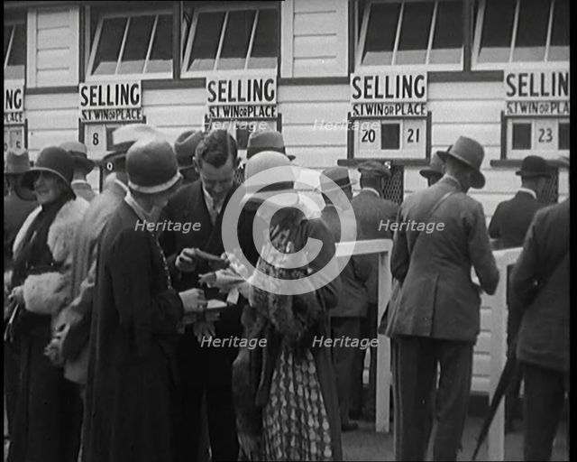 A Crowd of People Standing Outside a Totaliser/Tote Office at a Horse Race Course..., 1929. Creator: British Pathe Ltd.